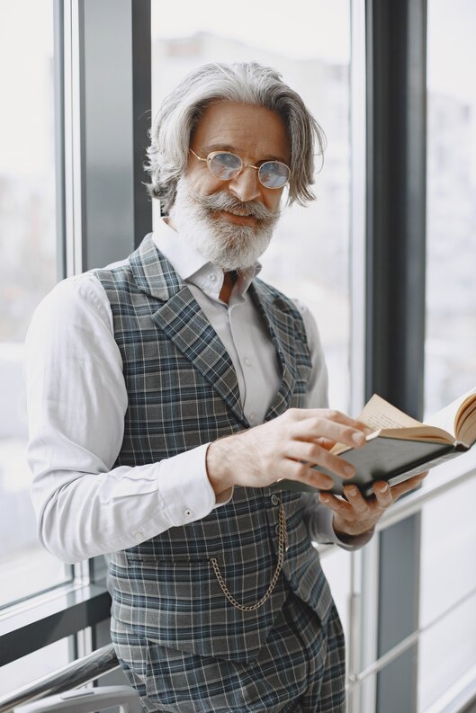 Professional autobiography writing services at Wolfox Global Publishing, showcasing a writer working on a manuscript with a notebook.